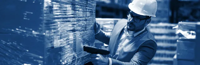 A technician scanning a barcoded asset tag during kitting
