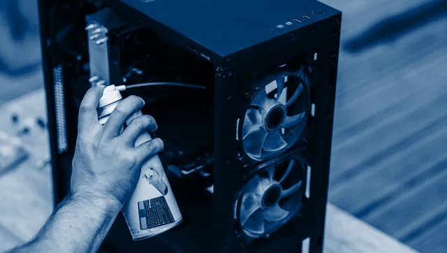 A COLAMCO technician servicing a desktop workstation